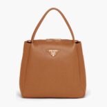 Prada Women Medium Leather handbag with the Prada Metal Lettering Logo Illuminating Its Center